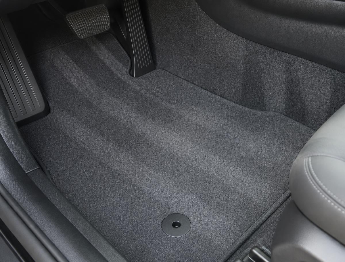 Spotless grey car carpet and floor mat after a professional interior carpet cleaning
